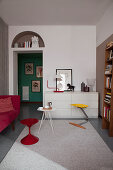 Brightly coloured accents in small, classic living room