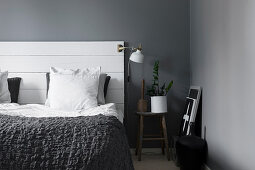 Bed headboard made from boards in grey and white bedroom