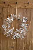 Handmade wintry wreath of paper leaves