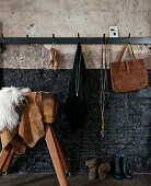 Industrial-style hallway: coat rack and old vaulting horse