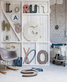 Decorative letters on white wooden shelves