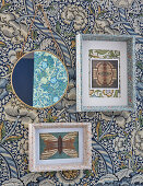 Floral picture frames on wall decorated in floral wallpaper