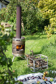 DIY stove made from metal barrel in garden