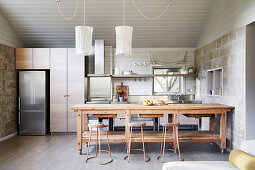 Rustic wooden table in kitchen in grey tones