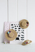 Handmade hat-shaped hair clips made from cord and small flower ornaments