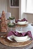 A place setting on a Christmas dining table
