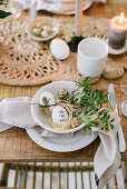 An Easter place setting in natural colours