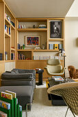 Designer furniture and fitted shelving in classic living room