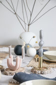 Arrangement of artistically twisted and curved candles on table
