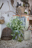 Wild carrots in a metal bucket and rustic objects as decoration