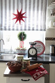 Country-house kitchen festively decorated with wreaths and star