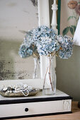 Dried blue hydrangeas in a vase on a vanity