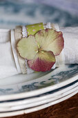 Homemade napkin ring with a dried hydrangea