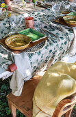 Place setting on set table in garden