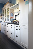 White country-house kitchen with blue-and-white accents