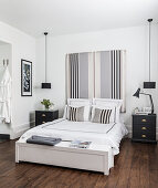 Striped bed headboard in masculine bedroom in black and white