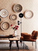 Living room with geometric wallpaper and round baskets decorating wall