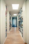 Long hallway lined with shelving