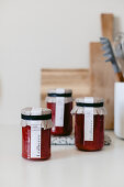 Strawberry jam in jars with DIY labels