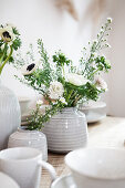 Ceramic vases with white garden flowers