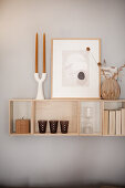 Wooden shelf with decorative objects on the wall