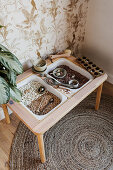 Play table with dried beans in nursery