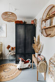 Boy's bedroom with industrial-style wardrobe and terracotta accents