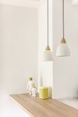 Two pendant lights above breakfast bar with wooden worktop