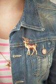 Reindeer brooch on jeans jacket