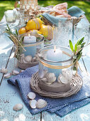 DIY lanterns with seashells as table decorations