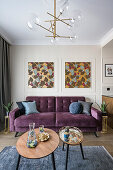 Purple sofa and coffee table set in open-plan interior