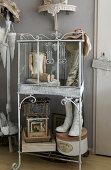 Metal shelf with vintage decorative objects