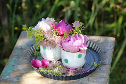 Peonies in cups