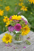 Colourful summer bouquet with sunflowers, dahlias, yarrow and hydrangeas