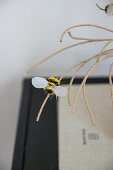 DIY beehive made of paper wire with small cone bees