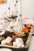 Snacks, and DIY ghosts made of plaster for Halloween