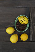 Lemon covered with cloves to repel bugs