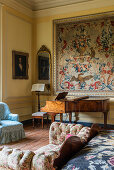 Piano and tapestry in the bedroom of a 17th century English country house.