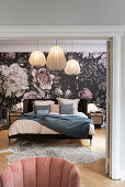 View into the bedroom with queen bed and floral wallpaper