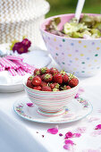 Leaf salad and fresh strawberries