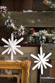 Christmas DIY snowflake decoration made from wooden popsicle sticks