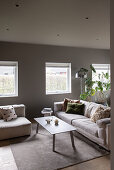 Upholstered furniture in the living room in beige and light grey