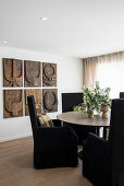 Elegant dining room with wooden reliefs on the wall