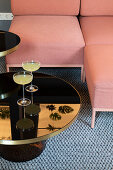 Pink sofa with elegant black table