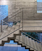 Concrete stairs with railing and metal balusters