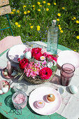 Easter table setting with basket of flowers