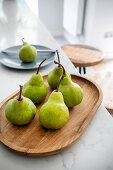 Pears on a wooden tray