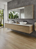 Modern bathroom with wall mounted double oak vanity and garden view