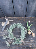 Wreath of cypress with snowdrops and name tag
