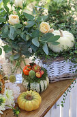 Autumnal decoration with pumpkins, chrysanthemums, roses, Mühlenbeckia
